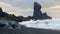 Icelandic Coastline with Black Cliff at Sunset, Volcanic Rocks with Blue North Atlantic Ocean Water, Shot in 8K