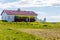 Icelandic eco house with grass on the roof, in the village on Flatey island, Iceland