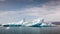 Icelandic glacial scenery, iceberg floating in the calm water