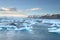 Icelandic glacier Jokulsarlon with icebergs floating in the sea