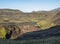 Icelandic landscape with blue Markarfljot river canyon, green hills and Einhyrningur unicorn mountain. Fjallabak Nature