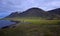 Icelandic landscape with the campsite at the hot pot Grettislaug on peninsula Skagi