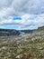 Icelandic landscape with flowing rivers surrounded by rocks and grass