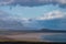 Icelandic landscape with mountains, blue sky and green grass on the foreground. West fjord part