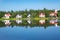 Icelandic landscape, view of Seydisfjordur with houses and reflecting in sea fjord lake water, Iceland