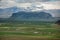 Icelandic landscape with volcanic lava ridge, glacier mountains