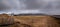 Icelandic landscape at winter. Farmland, farmhouse stormy cloudy sky Iceland europe