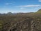 Icelandic lava desert landscape with footpath of Laugavegur hiking trail with view on Tindfjallajokull glacier mountains