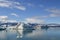 Icelandic mountain lake and glacier under the sun