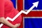 Icelandic pregnant woman on flag of Iceland background. Birth rate up