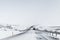 Icelandic road covered with snow, rural winter