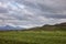 Icelandic rural landscape with tractor harvesting hay in a field Iceland Scandinavia