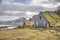 Icelandic turf huts, mountains and road