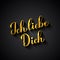 Ich liebe Dich gold calligraphy hand lettering on black background. I Love You in German. Valentines day typography