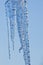 Icicle melting isolated against a blue sky