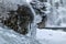 Icicle on a rock in a forest, close-up view