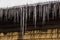 Icicle on the snow covered rooftop