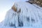 Icicles background on the ice wall on Baikal lake at winter