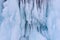 Icicles background on the ice wall on Baikal lake at winter