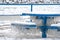 Icicles on blue park bench and table