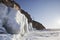 Icicles. Coast rock of Lake Baikal. Winter landscape