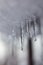 Icicles dripping from snow.