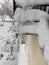 Icicles hanging from the balconies of buildings in Madrid, in Spain. Completely white landscape with snow in the surroundings.