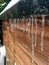 Icicles hanging down from a shed