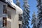 Icicles hanging from the roof of the building in the mountain