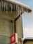 Icicles hanging from thatched roofs