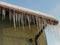 Icicles hanging from thatched roofs