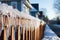 Icicles of ice hang from the roof