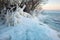 Icicles and icy frozen branches of tree at the coast.