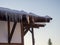 Icicles on the roof. Spring at the ski resort