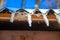 Icicles of snow hanging from a roof in a winter sunny day