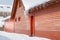 Icicles and snow on an old wooden cottage