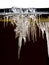 Icicles and snow on roof closeup. Winter weather concept. Froze and ice background. Snow and icicle. Melting icicles. Icicles and