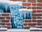 icicles on the wall of the house