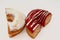 Icing powdered confectioners\' sugar and Strawberry flavored ring donut, A glazed, yeast raised,