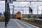 ICM Intercity train called Koploper rushes along platform at station Lansingerland Zoetermeer