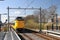 ICM koploper trains rushes aling platform on the brand new train station Zoetermeer-Lansingerland in the Netherlands.