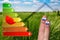 Icon of house energy efficiency rating with cute fingers, poppy and green background