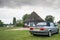 Iconic, 80s soft-top 2-door, german manufactured sports car seen parked at a boating marina.