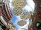 Iconic abstract circle sculpture artwork hanging above a sidewalk at in front of Haymarket shopping center near China town.