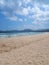 Iconic Banyuwangi (indonesia) Beach called Pantai Pulau Merah with blue sky and a uninhabited island. taken at May, 2023