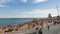 Iconic Barceloneta crowded beach and W Hotel panorama, Barcelona