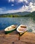 Iconic Bled scenery. Boats at lake Bled, Slovenia, Europe. Wooden boats with Pilgrimage Church of the Assumption of Maria on the