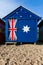 An iconic Brighton beach hut painted in the Australian flag colo