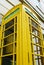 Iconic British red phone booth repurposed as defibrillator station and painted yellow