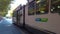 Iconic city tram traveling in front of Town Hall along Swanston Street